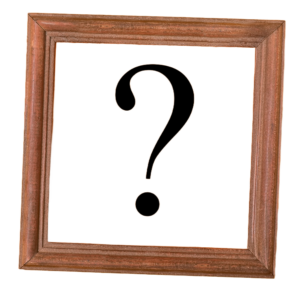 A question mark is inside a brown wooden frame picture frame. 